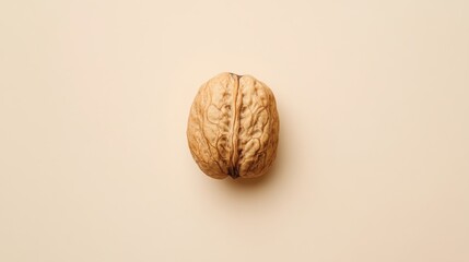 A detailed closeup reveals the intricate texture of a walnut resting on a solid pastel background, emphasizing its natural beauty and unique features