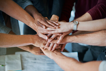 Wall Mural - Employees, hands and pile in huddle for solidarity, teamwork and closeup in company mission. Business people, stack and circle for motivation with target, together and group for work collaboration