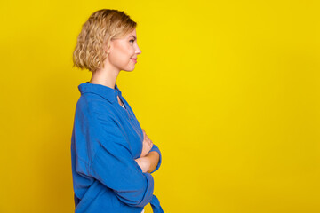 Sticker - Profile photo of nice young girl crossed arms empty space wear blue shirt isolated on yellow color background