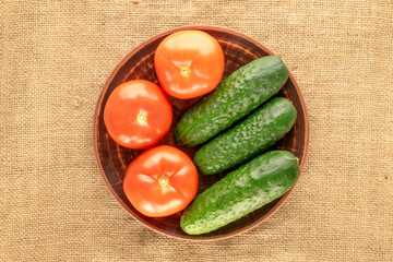 Fresh ripe vegetables on jute cloth, macro, top view.