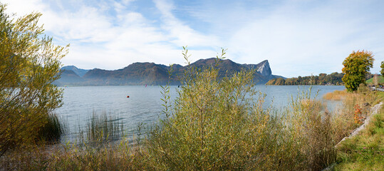 idyllic autumnal landscape lake Mondsee, view to Drachenstein mountain, austria