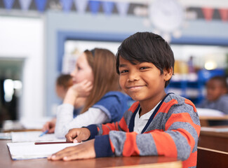 Aufkleber - Portrait, smile and boy in classroom for education in growth, child development and notebook for lesson. Happy, learning and face of student with exam notes, knowledge and study at elementary school