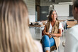 © EFStock - High school counselor in conversation with group of students offering guidance and support. Teacher listening with empathy