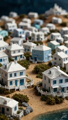 Sticker - Miniature model of a coastal village with white buildings.