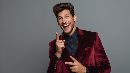 Portrait of cheerful excited joyful satisfied handsome attractive fashionable macho guy dressed in formal outfit dark velvet pointing on empty blank copyspace isolated on gray background