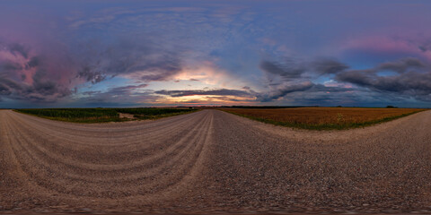 Wall Mural - hdri 360 panorama on gravel road among fields in spring nasty evening before sunset in equirectangul