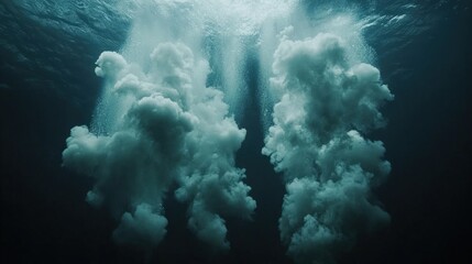 Underwater view of two large splashes from above the surface.