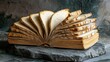 © AminaDesign - This artistic representation features an open book made of bread slices, merging culinary art with scripture symbolism in a stunning kitchen, showcasing creativity and visual delight