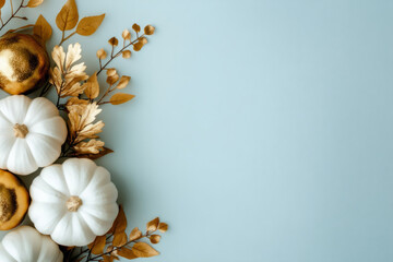 Wall Mural - White pumpkins and autumn leaves on a pastel blue background. Seasonal fall theme