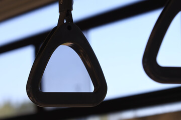 Poster - A close-up shot of a metal object with a window visible in the background, perfect for illustrating industrial or mechanical concepts