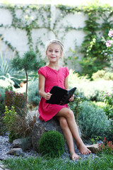 Wall Mural - little girl reading bible book