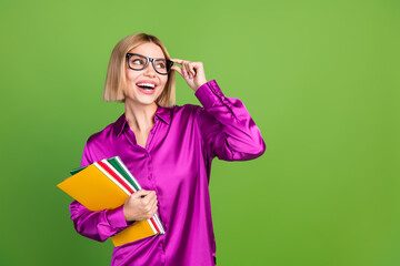 Wall Mural - Photo of lovely cute gorgeous girl wear trendy pink clothes look empty space news isolated on green color background