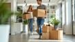 © neirfy - A Couple Excitedly Moving Into Their New Home, Surrounded by Numerous Cardboard Boxes Awaiting Unpacking