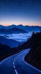 Wall Mural - Road winding through mountains at night travel picture
