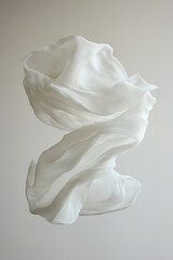 Poster - Winding white fabric swirling in mid-air against a plain background, captured in a serene and minimalist setting