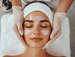 © Rocher Creative - Woman in a spa getting face rejuvenation treatment