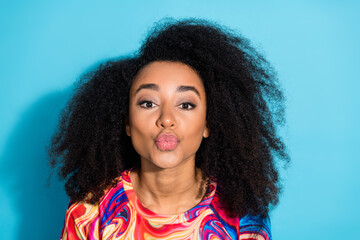 Sticker - Photo portrait of beautiful woman with curly hair chevelure in trendy sweatshirt pouted lips kissing cadre isolated on blue color background