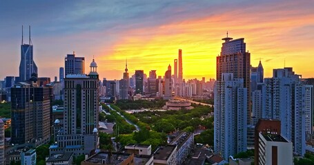 Wall Mural - Aerial shot of modern city skyline and commercial buildings at sunrise in Shanghai