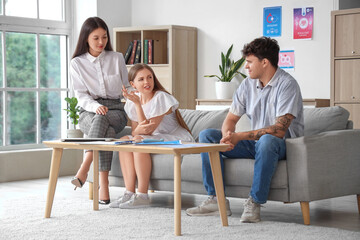 Poster - Female Asian sexologist working with upset young couple in office