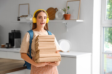 Poster - Shocked female student in headphones with backpack and books at kitchen