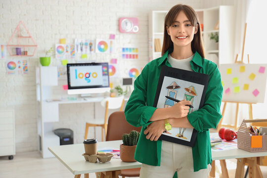 Graphic designer with tablet and sketch in office