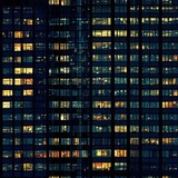 Seamless pattern of skycraper or office building windows at night - tiles, texture