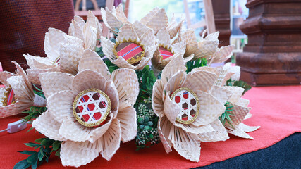 Bamboo woven flowers. Close-up of artificial flower bouquets woven from bamboo, a unique and beautiful traditional Thai handicraft. Selective focus