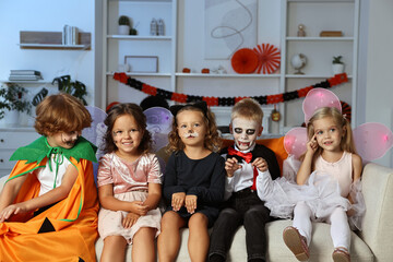 Wall Mural - Funny children wearing costumes for Halloween celebration in room