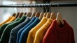 © Business Image - Colorful knitwear on hangers for vibrant fall wardrobe inspiration and decor