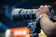 © suman - Close-up of a photographer using telephoto lens to captured a moment