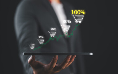 Aufkleber - Businessman holding tablet which display virtual graph chart and shopping trolley cart for increasing of online sale business growth concept.