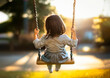 © fujiwara - ブランコに乗る女の子後ろ姿