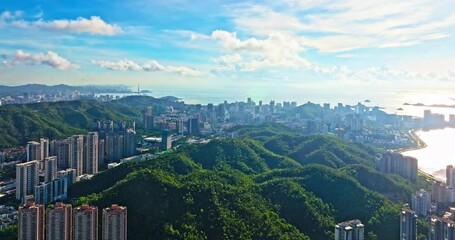 Wall Mural - Aerial shot of city skyline with ocean and mountains nature landscape in Zhuhai