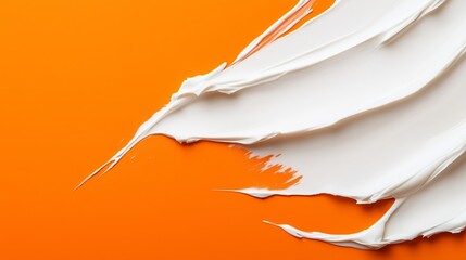 Poster - a close-up view of white paint smeared artistically on a vibrant orange canvas, showcasing texture a