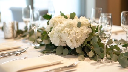 Elegant table setting with floral centerpiece for a formal dining experience.