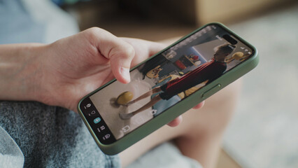 Poster - smartphone application with various video content displayed on phone screen. close up of teenager sc