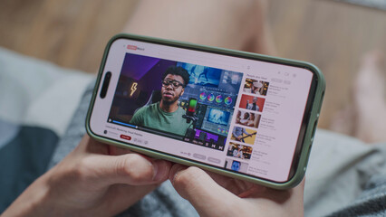 Poster - video sharing platform with blogger content about color correction displayed on smartphone screen. c