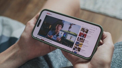 Poster - video sharing platform with blogger content about video editing displayed on smartphone screen. clos