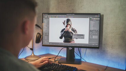 Fototapete - Young designer creates 3D model of game character using PC. Interface of professional 3D modeling software. Teenage boy working on freelance project on computer at home. Game development concept.