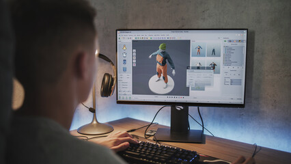 Fototapete - Young designer creates and draws clothes using PC. Interface of professional 3D modeling or design software. Teenage boy working on freelance project on computer at home. Game development concept.