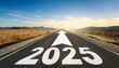 © Niser - Road to 2025 with an empty road with written 2025 and arrow pointing towards the horizon to represent the future and positivity and success of the new