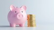 © Tackey - A cute pink piggy bank beside a stack of shiny coins, symbolizing savings and financial planning.