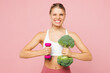 © ViDi Studio - Young strong sporty cool woman wear white top casual clothes hold in hand broccoli, dumbbell isolated on plain pastel light pink background Proper nutrition healthy fast food unhealthy choice concept