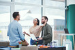 © peopleimages.com - office, employees and happy with laptop on meeting for project with teamwork and collaboration. Business, people and smile or satisfied with coworking for deadline with discussion and conversation