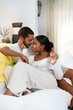 © Caia Image - Couple relaxing on sofa
