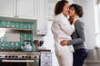 © Caia Image - Happy couple in kitchen