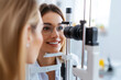 © barmaleeva - Woman undergoing an eye examination using specialized ophthalmology equipment