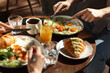 © New Africa - Couple having tasty breakfast at wooden table in cafe, closeup