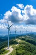 © Sasint - A wind farm on a hillside, with turbines generating clean energy, representing the shift towards renewable energy in environmental conservation