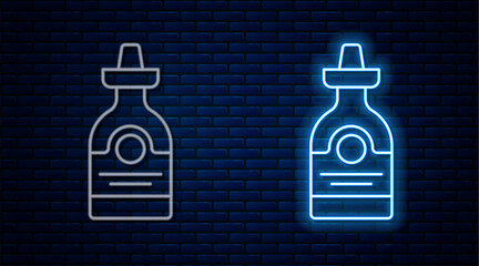 Wall Mural - Glowing neon line Tequila bottle icon isolated on brick wall background. Mexican alcohol drink. Vector